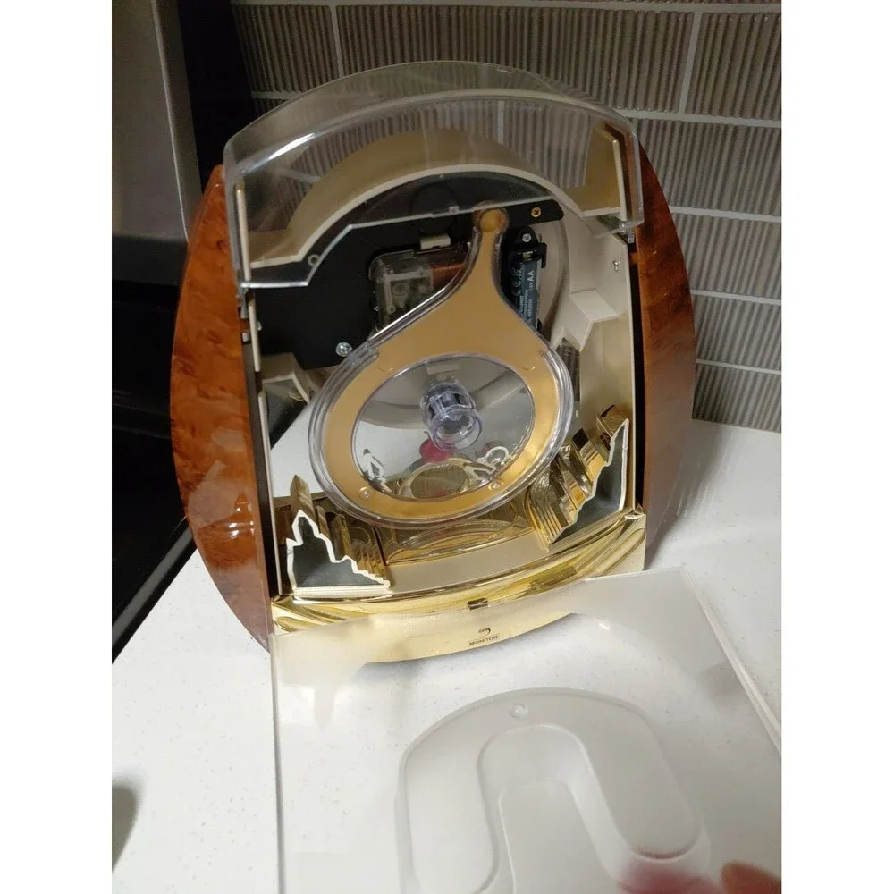 Seiko QXW115BRH Contemporary Fantasy Swing Musical Motion Decorative Clock